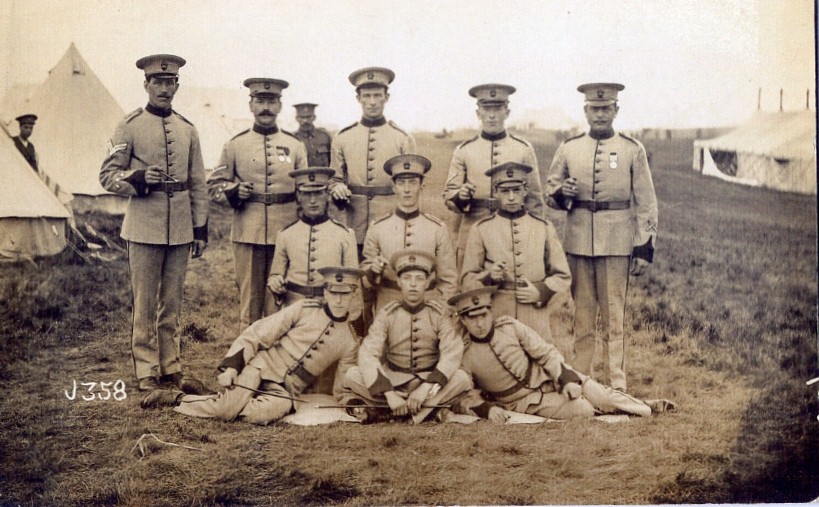 The-distinctive-grey-uniform-of-the-1st-VB-with-red-facings-black-badges-and-black-buttons-c.1908-Courtesy-–-Col-Denis-Wood.jpg